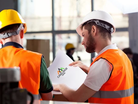 Two contractors reviewing a Cascade QMS Safety Manual