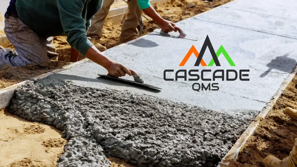 Person smoothing out concrete on a sidewalk.