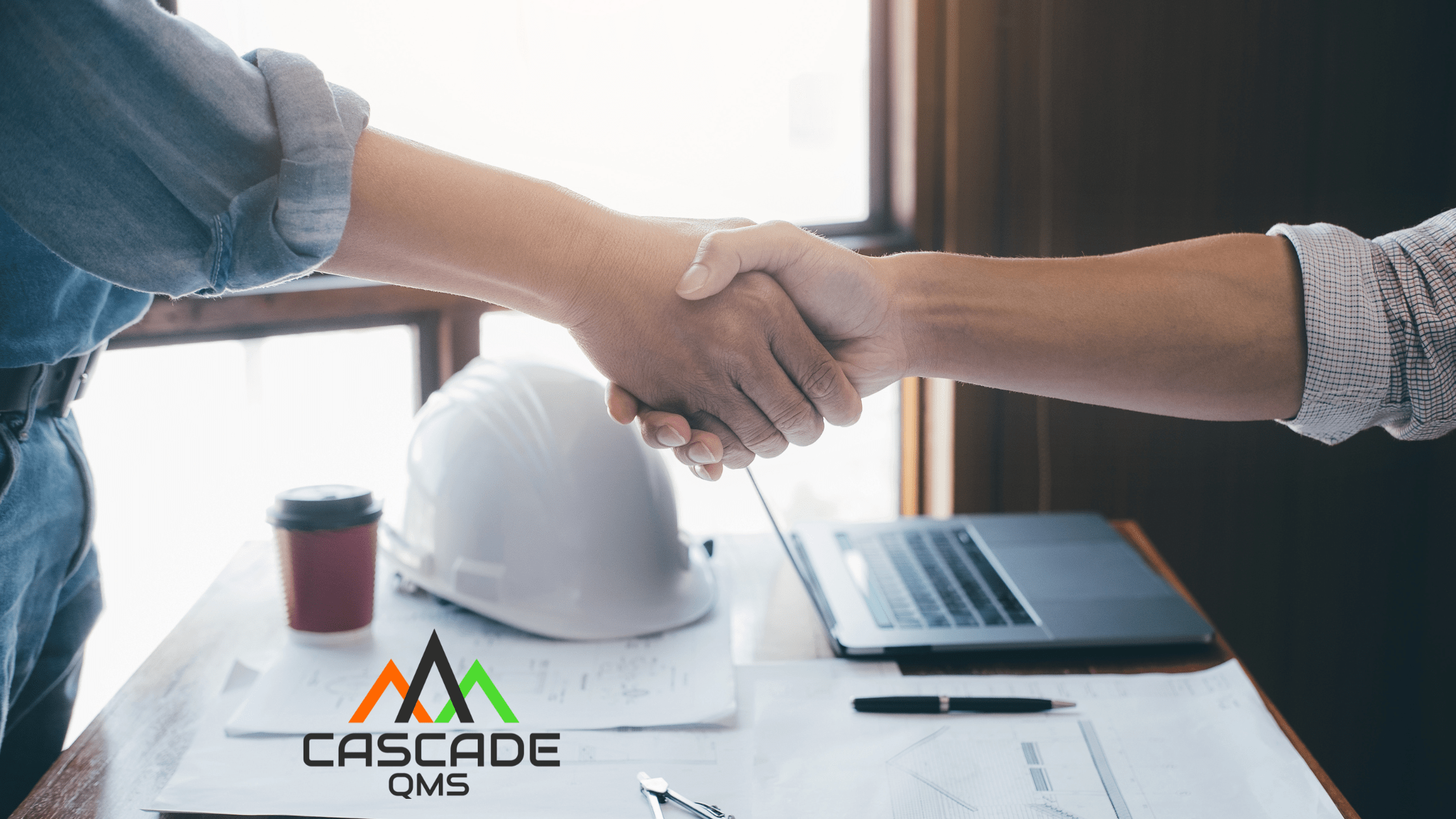 Business owner shaking hand with Cascade QMS Safety Consultant