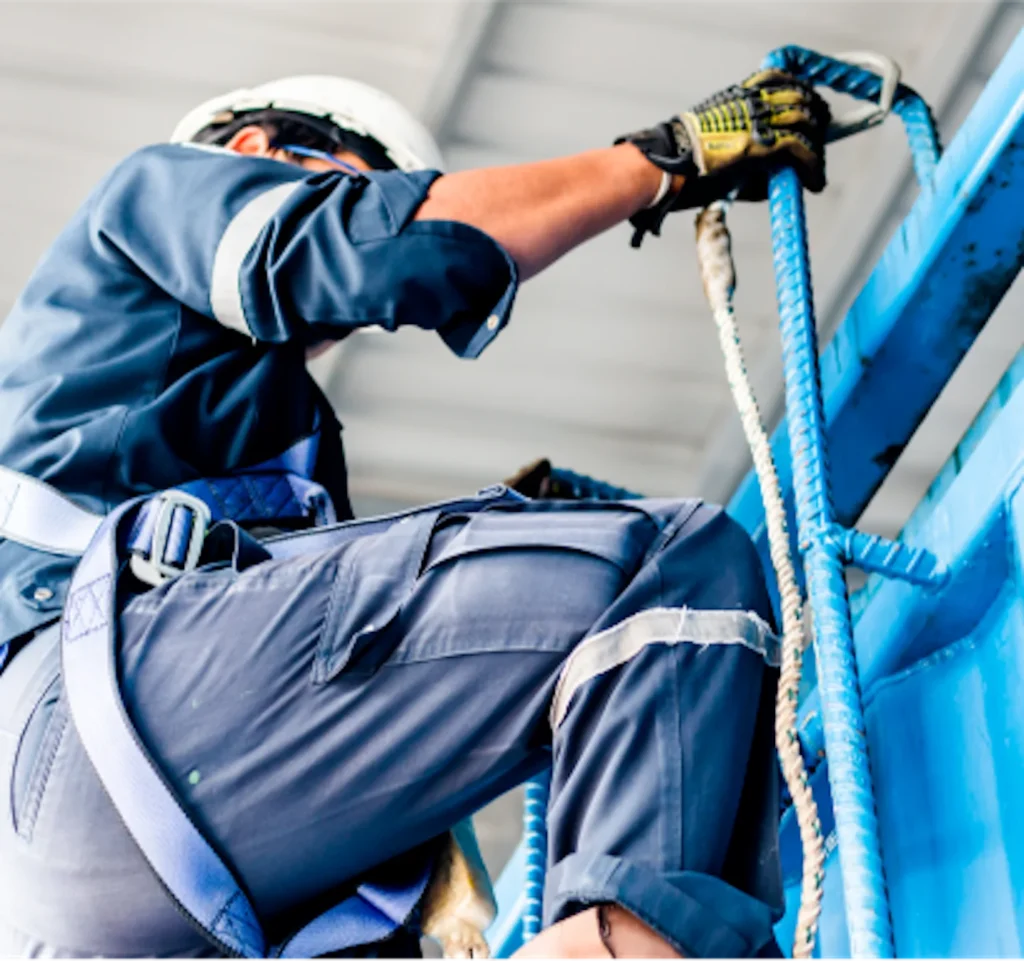 Person wearing harness climbing up stairs.