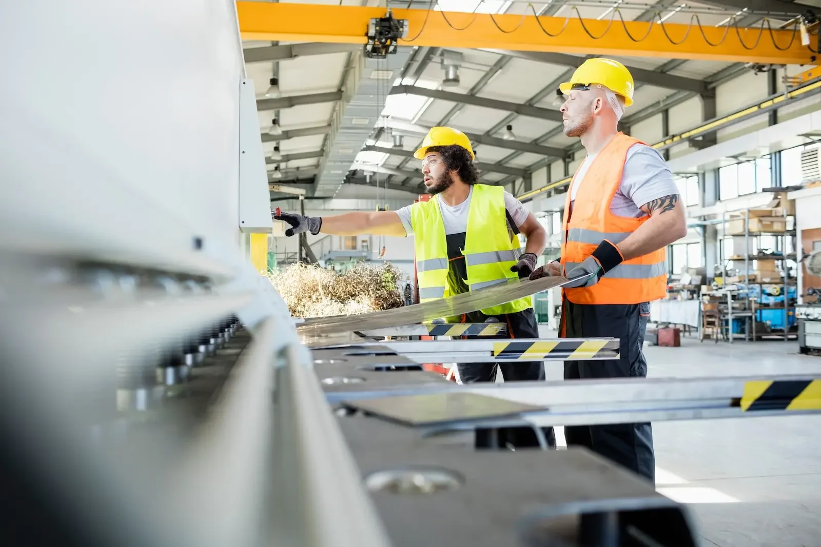 Manufacturing contractors using sheet metal in a facility.