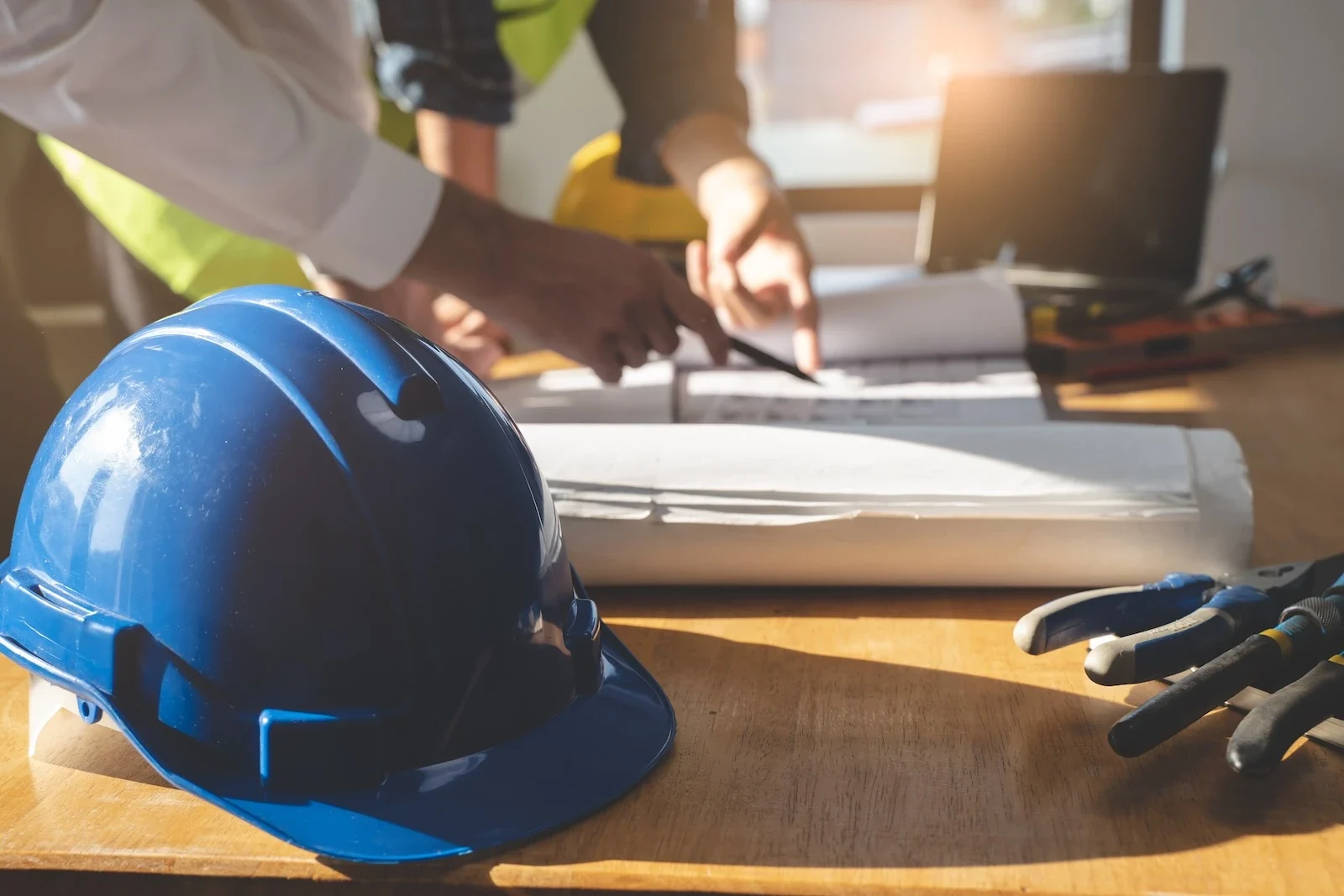 Contractors review safety paperwork.
