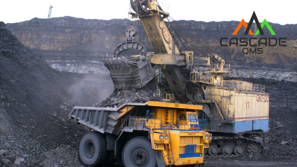 Mining jobsite being peformed with heavy equipment per Browz compliance standards with Cascade QMS logo in corner