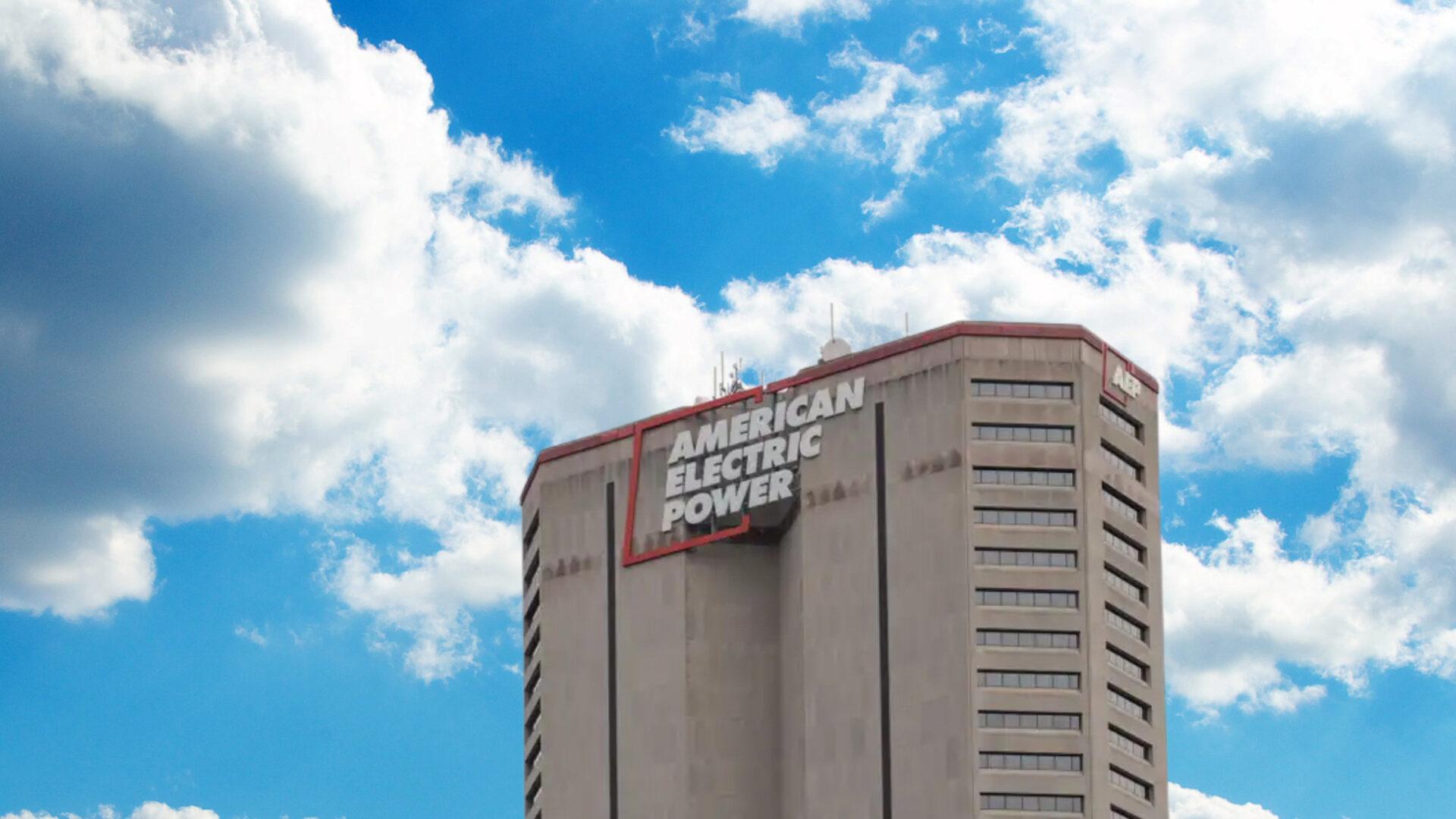 American Electric Power building with clouds that require Vero Compliance