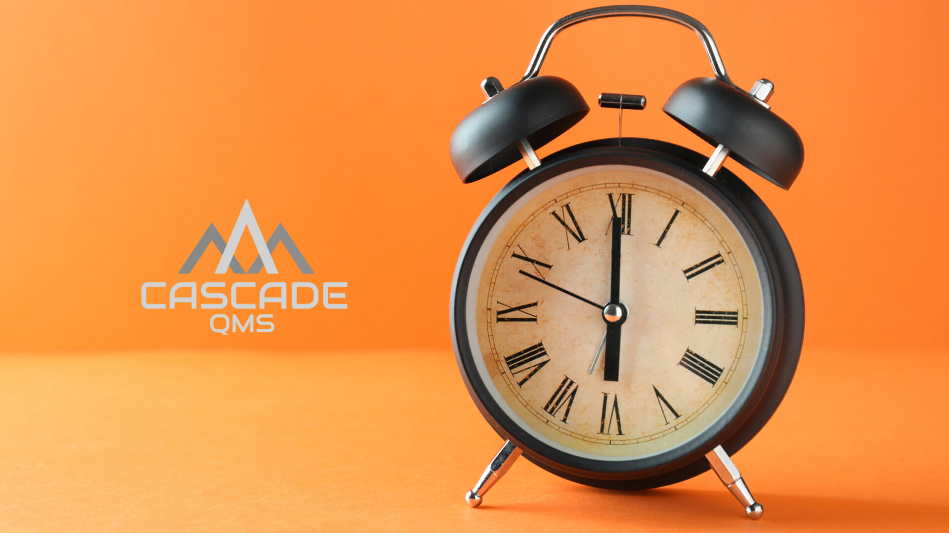 clock on orange with cascade qms logo