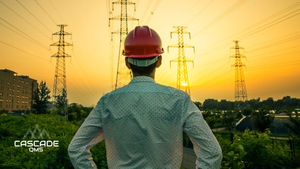 PG&E Vendor looking at powerlines in sunset with cascade qms logo