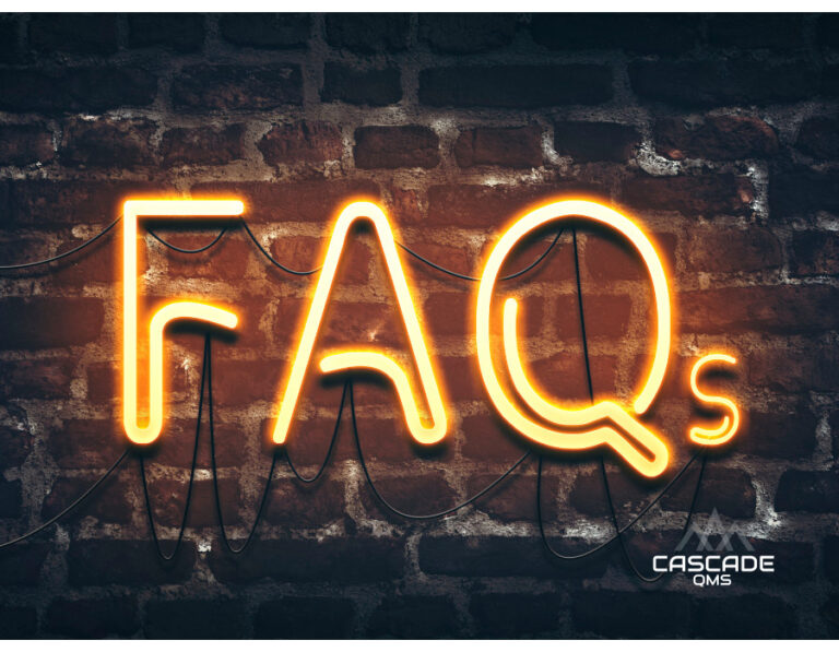 FAQ in neon lights with cascade qms logo on brick wall with masonry